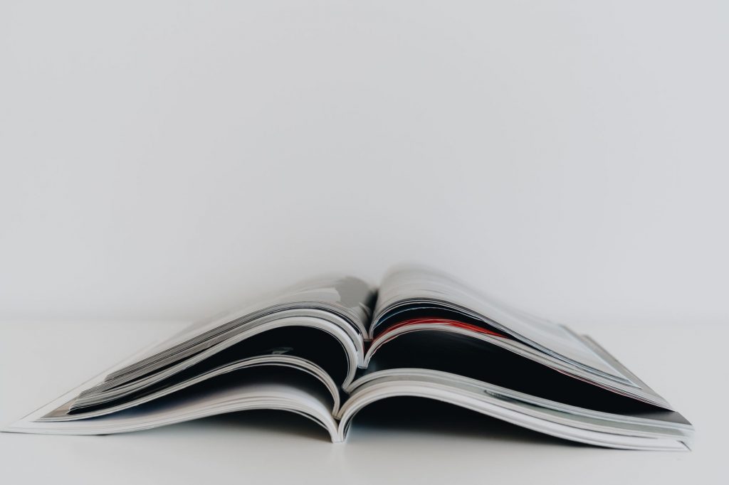 a stack of open magazines