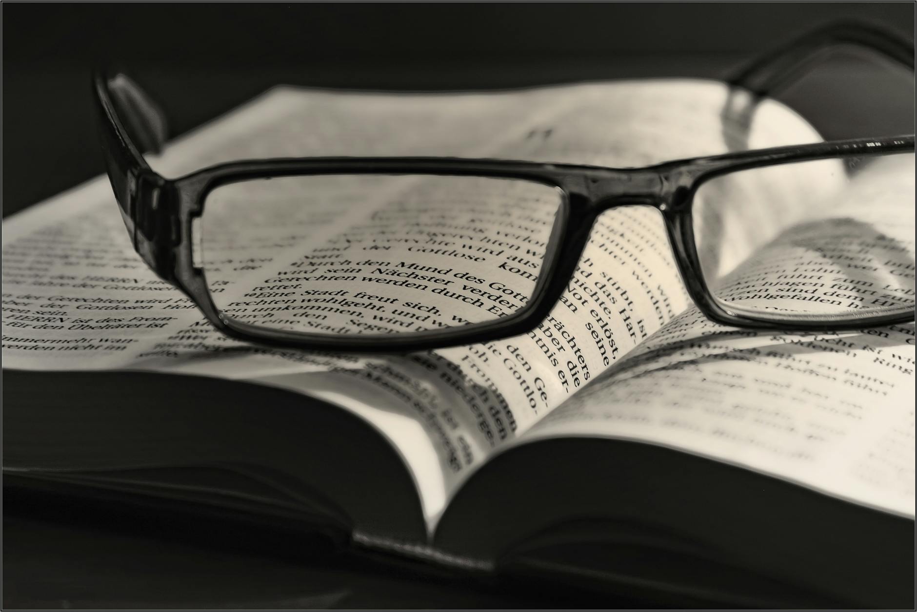 pexels-photo-267549 black eyeglasses placed on white book