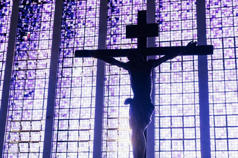 jesus christ in church with mosaic windows