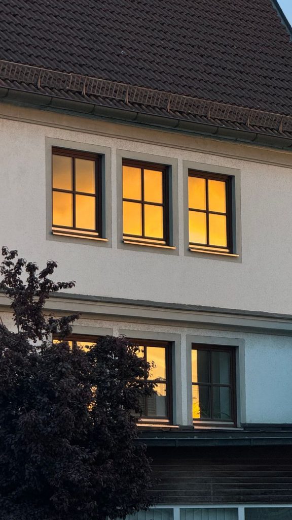 warm sunset light in bavarian house windows
