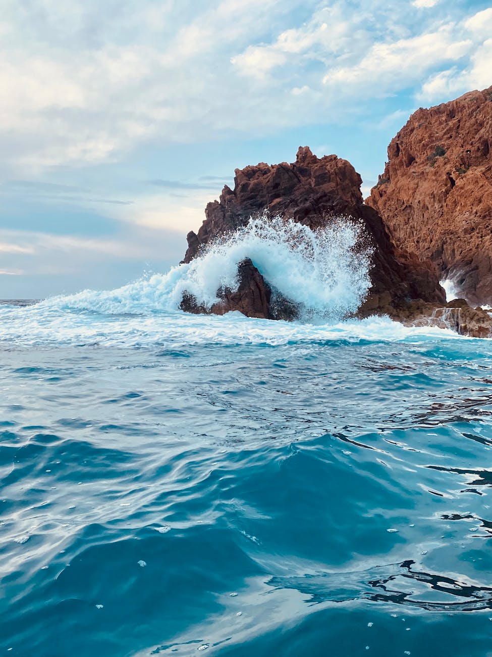 wave crushing on rocks on sea shore