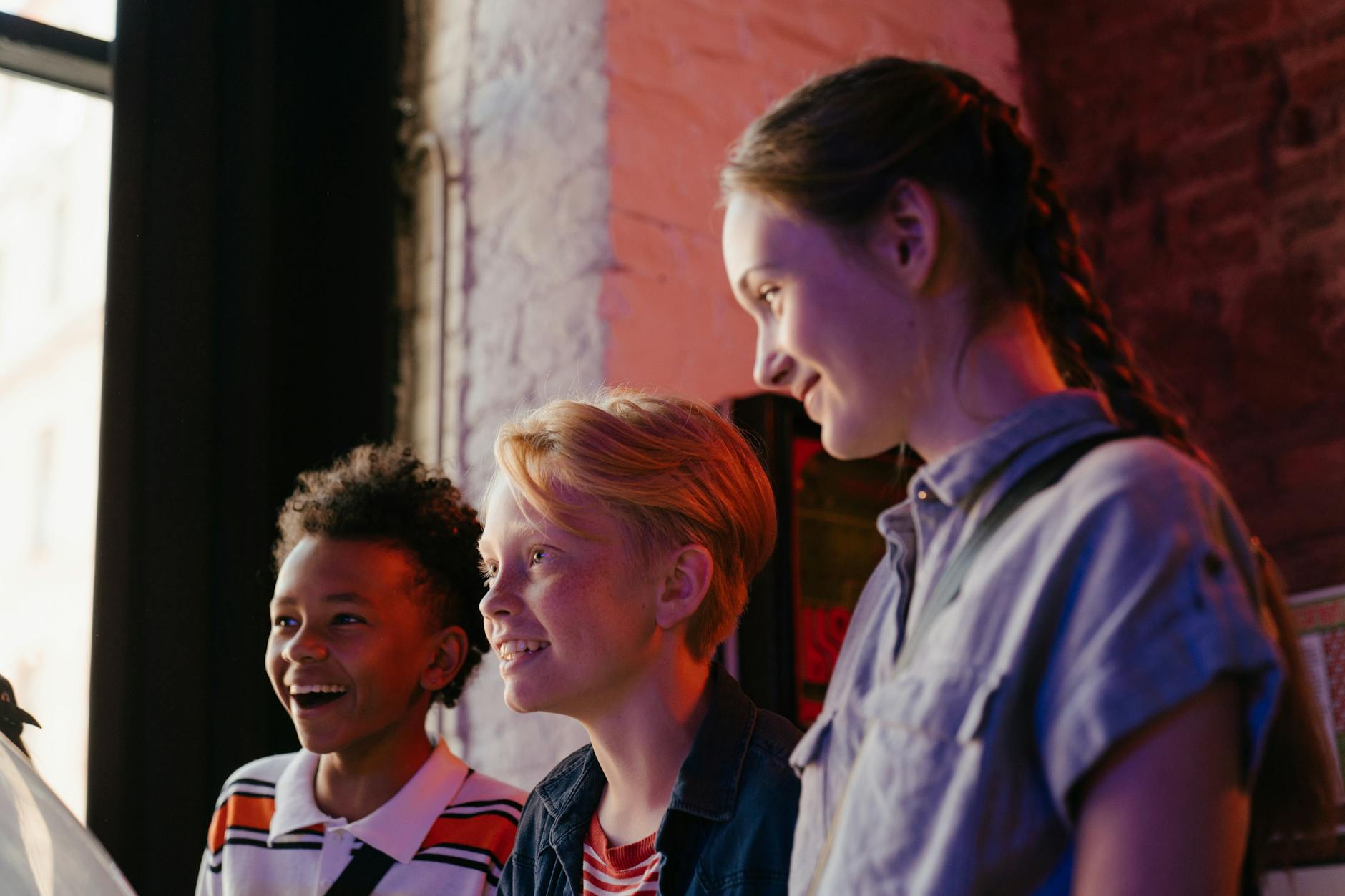 man in blue dress shirt beside woman in red and white stripe shirt